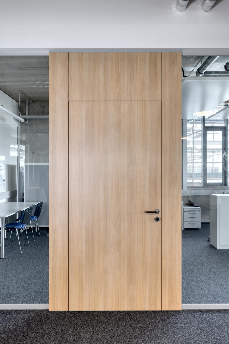 Erhardt + Leimer electrical installations | wooden door