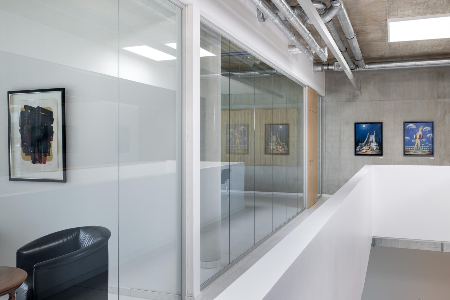 Erhardt + Leimer electrical installations | glass walls near the stairs