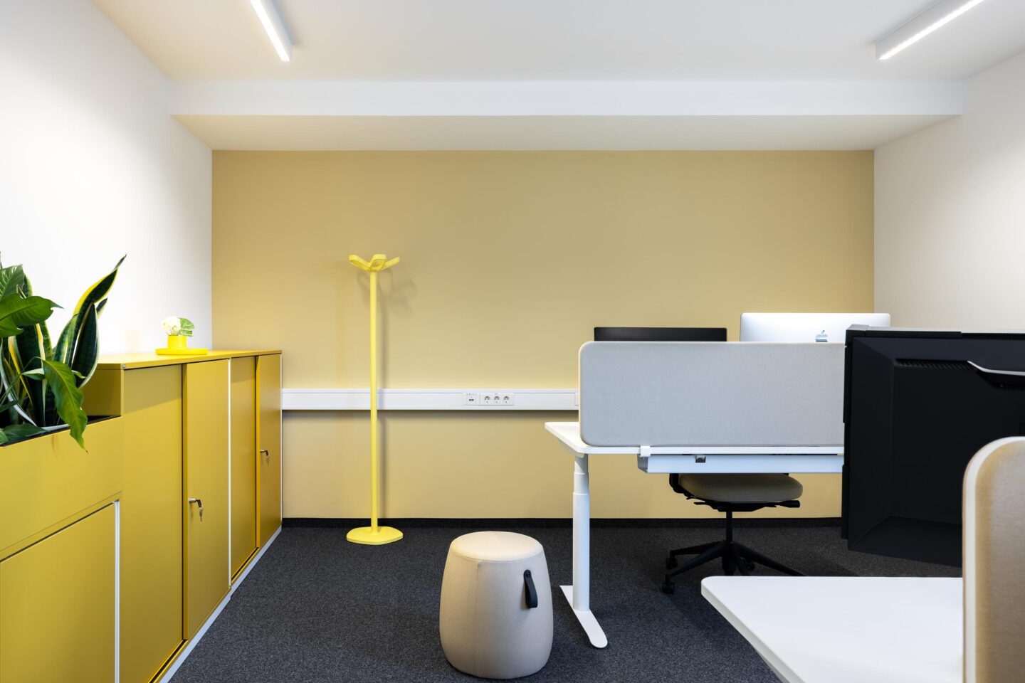 Nomos Baden-Baden | Soft yellow tone from Farrow & Ball Hay in the working environment.